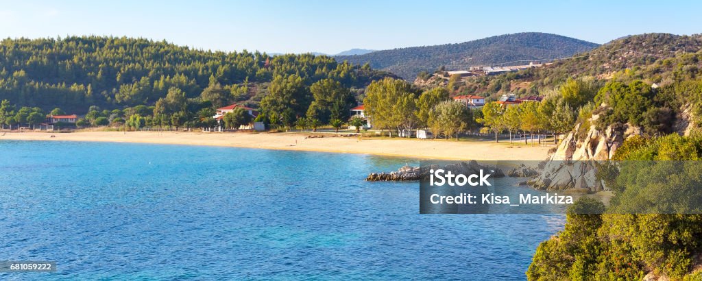 Vacation background with sea water and sandy beach aerial view Vacation banner panoramic background with sea water and sandy beach aerial view in Sithonia, Greece Aegean Sea Stock Photo