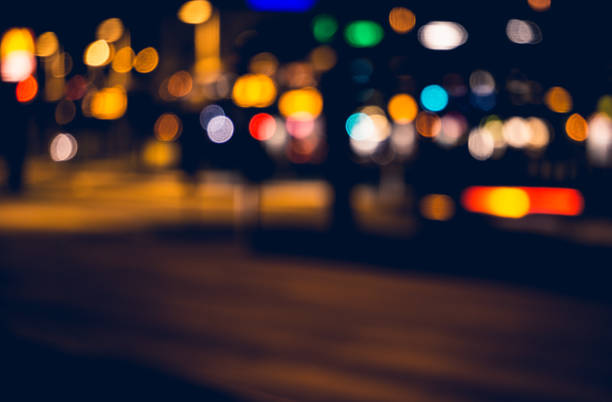 istock Bokeh effect from street lights and car at night. 681059488