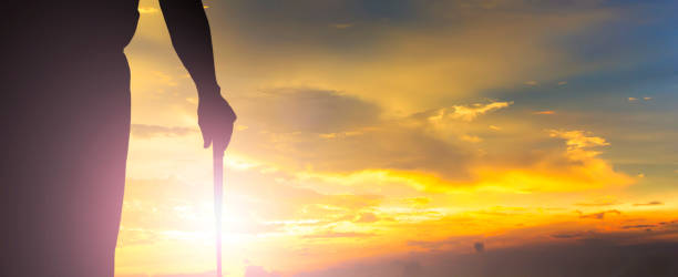 istock Sunset with hand of golfer. 681059490