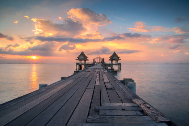 istock Wooded bridge in the port and sunset 681063312