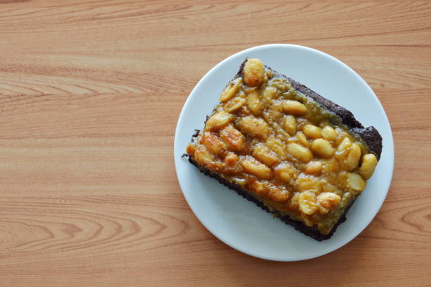 istock peanut butter caramel topping dark chocolate cake on plate 681064068