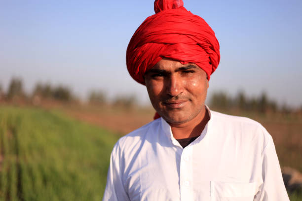 istock Farmer standing portrait in the field 681065218