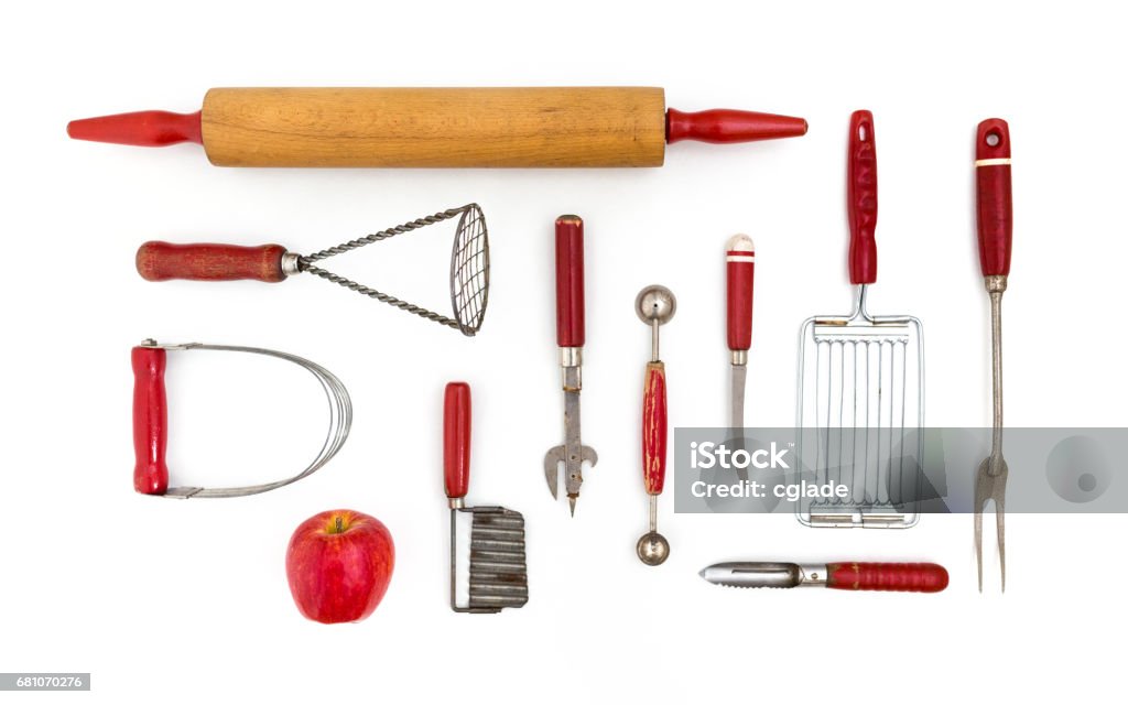 Kitchen Untensil Collection Collection of red kitchen tools on white background Antique Stock Photo
