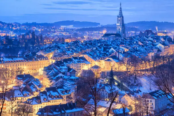 Old Town of Bern, capital of Switzerland, covered with white snow in the evening blue hour