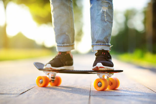 istock Hipster girl with skateboard outdoors. Closeup skateboarding 681071370