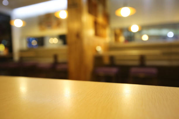 istock Wooden board empty table blur in coffee shop. 681072248