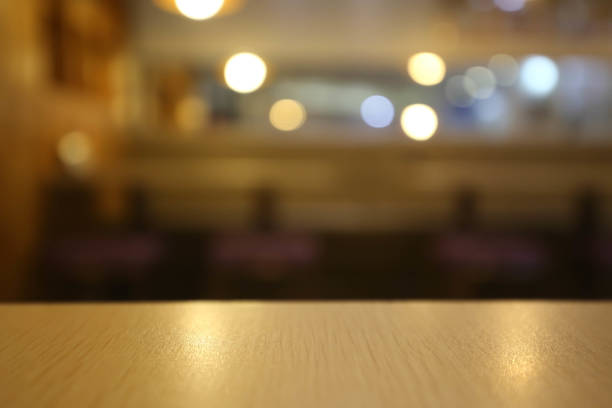 istock Wooden board empty table blur in coffee shop. 681072258