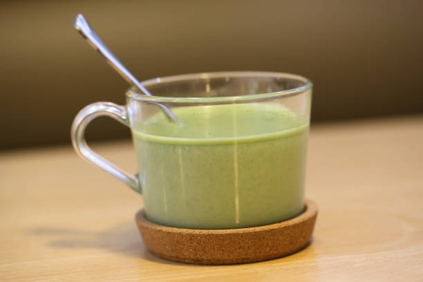 istock Matcha latte with spoon on the wood table 681078214
