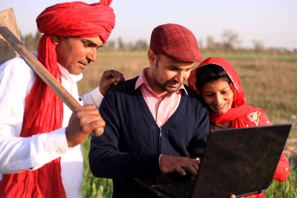 istock Farmer using laptop outdoor in nature 681078244