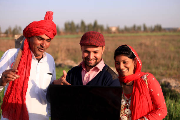 istock Farmer using laptop outdoor in nature 681078276