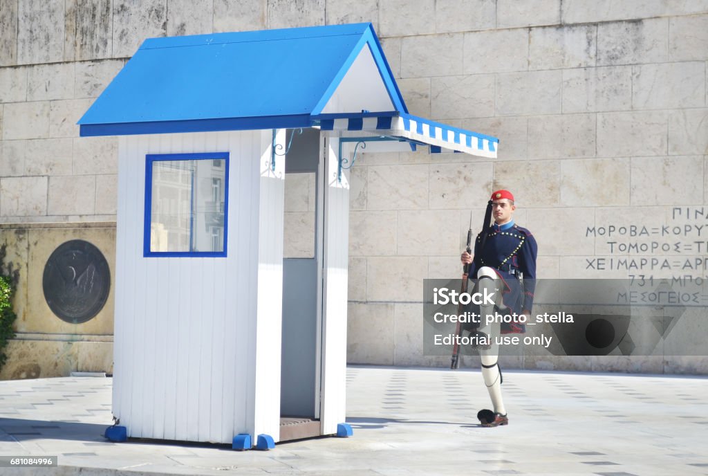 greek evzones - greek tsolias - guarding the presidential mansion in front of the tomb of the unknown soldier ATHENS GREECE, JANUARY 12 2016: greek evzones, greek tsolias, guarding the presidential mansion in front of the tomb of the unknown soldier, army infantry. Editorial use. Adult Stock Photo