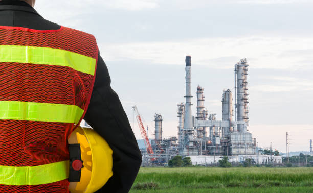 istock Hand or arm of engineer hold yellow plastic helmet 681090172