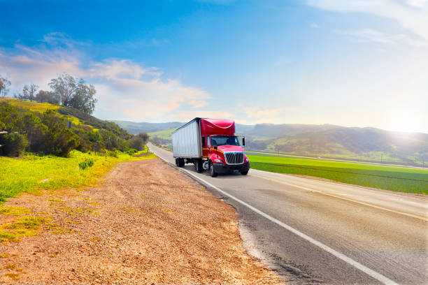 istock Red Truck on a country road 681090892