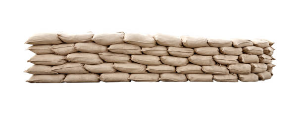 Many canvas bags stacked in a pile Many canvas bags stacked in a pile. Packages stacked in neat rows. Bulk products in bags . Warehouse business. Storing products in the warehouse. barricade stock pictures, royalty-free photos & images