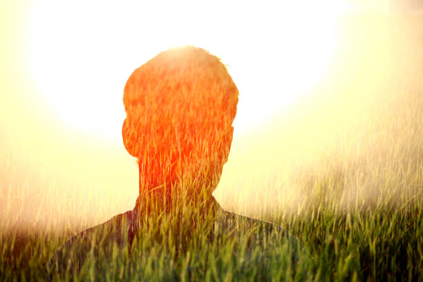 Multiple exposure image of a farmer in field.
