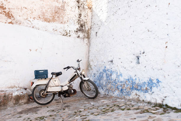 Abandoned small motorbike in remote urban area