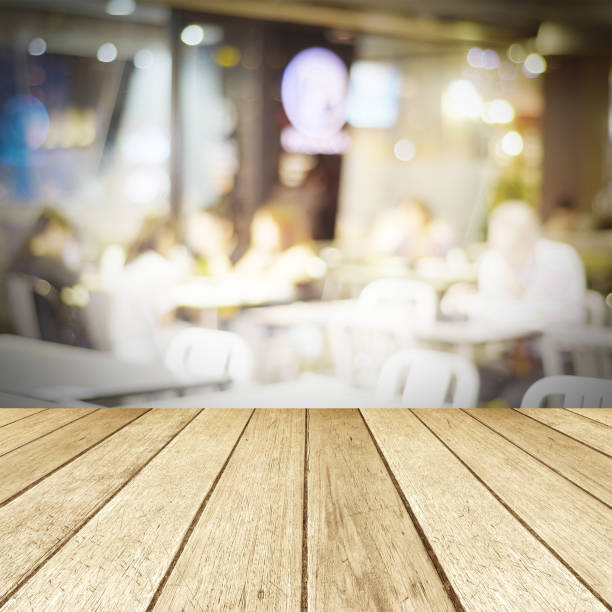 istock Perspective wood and blurred cafe with bokeh light background. product display template 681146642