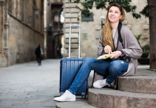istock Blond cheerful girl holding brochure 681146720