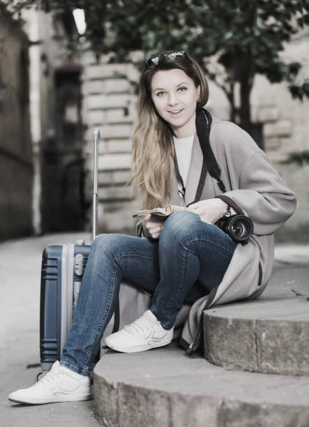 istock Blond glad girl holding brochure 681146726