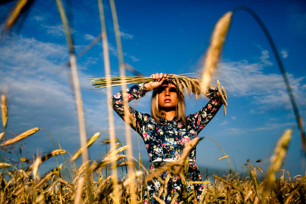 istock Woman in a field with ears 681147704