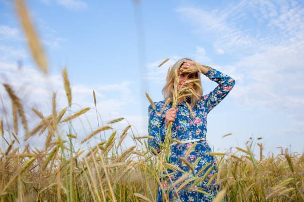 istock Woman in a field with ears 681147710