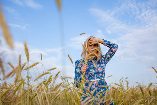 istock Woman in a field with ears 681147732