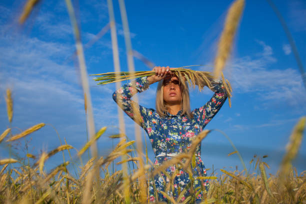 istock Woman in a field with ears 681147734