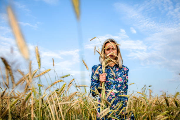 istock Woman in a field with ears 681147754