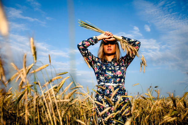 istock Woman in a field with ears 681147760