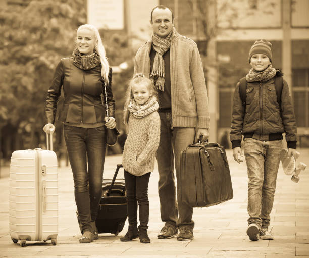 istock Parents with two kids  chasing streets 681155788
