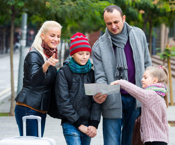 istock Family reading city map 681155800