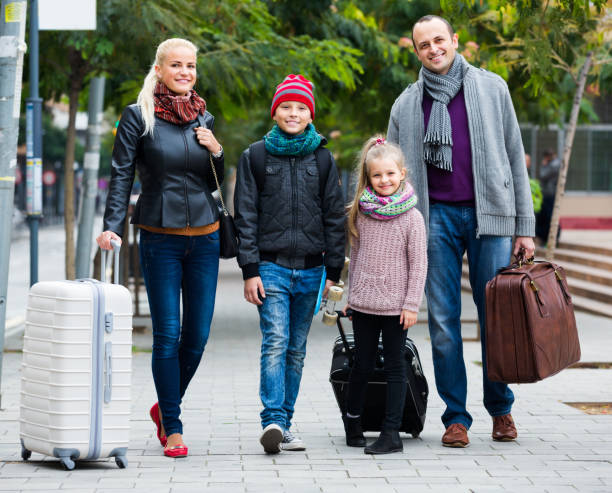 istock Parents with two kids chasing streets 681155818