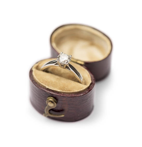 istock Single diamond solitaire engagement ring in vintage leather burgundy box 681161656