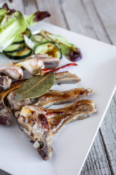 istock Fried lamb ribs on wood background 681165646