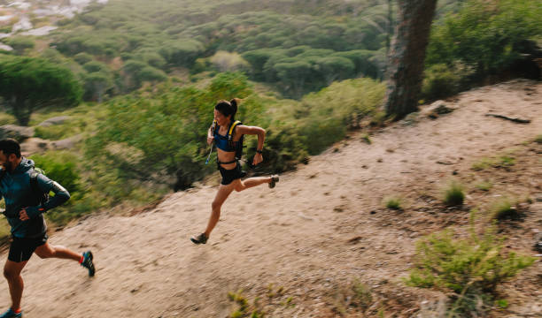 istock Couple of runners on mountain trail 681177580