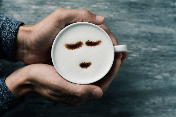 istock young man with a cup of cappuccino 681178672