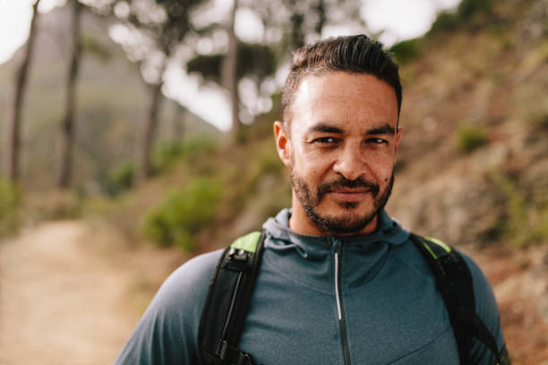 istock Fit young man standing on mountain trail 681179020