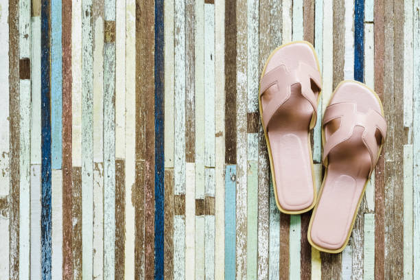 istock Sandals on grungy wood background top view with copy space 681179156