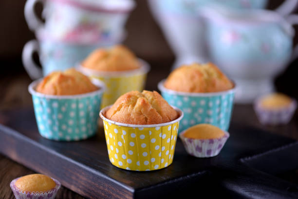 istock Classic muffins with raisins on a wooden background. 681179580