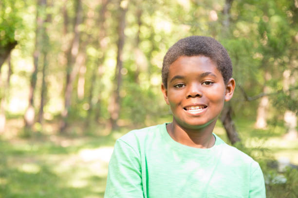 istock Pre-adolescent, African descent boy outdoors in spring or summer. 681197924