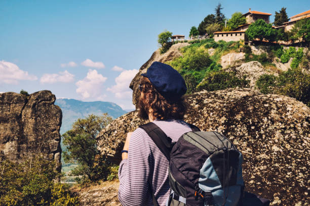 istock Youn Man Traveler with Backpack Hiking on Meteora, Greece 681199132