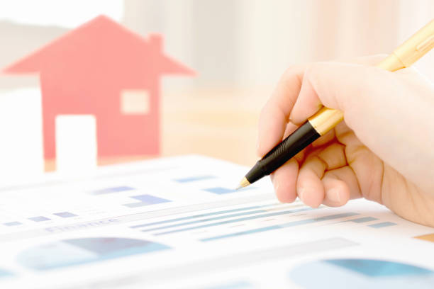 istock Businesswoman holding a pen and analyze data 681207206