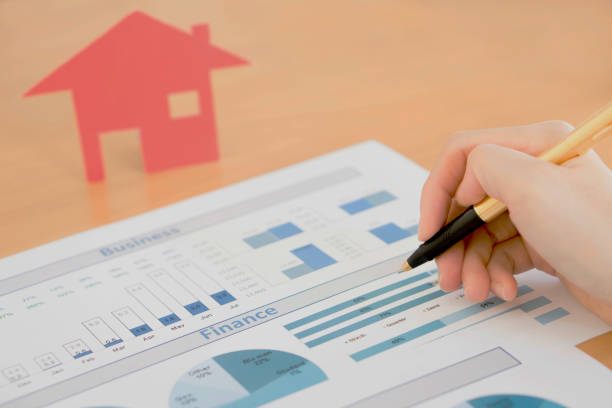 istock Businesswoman holding a pen and analyze data 681207302