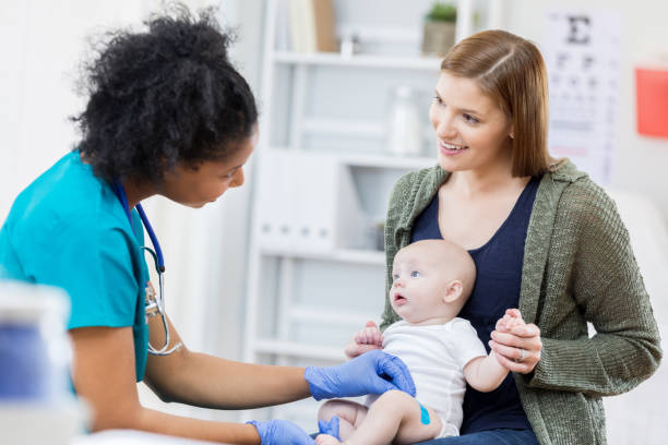 istock Nurse puts bandage on infant patient 681213846