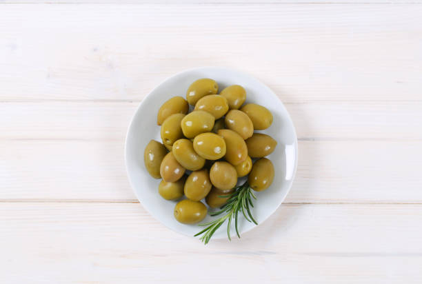 istock green olives with rosemary 681222034