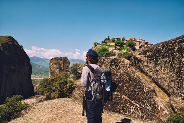 istock Youn Man Traveler with Backpack Hiking on Meteora, Greece 681222036