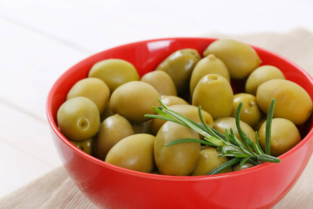 istock green olives with rosemary 681236380