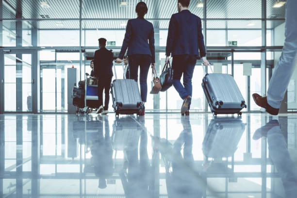 istock Group of people with luggage walking to exit gate 681243626