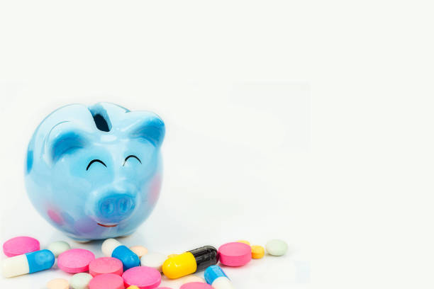 piggy bank with pill  isolated on white - toxic substance spilling pouring bottle imagens e fotografias de stock