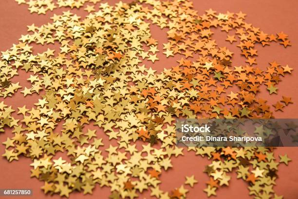 Background With Small Golden Whitish Stars On A Rosy Background Stock Photo - Download Image Now